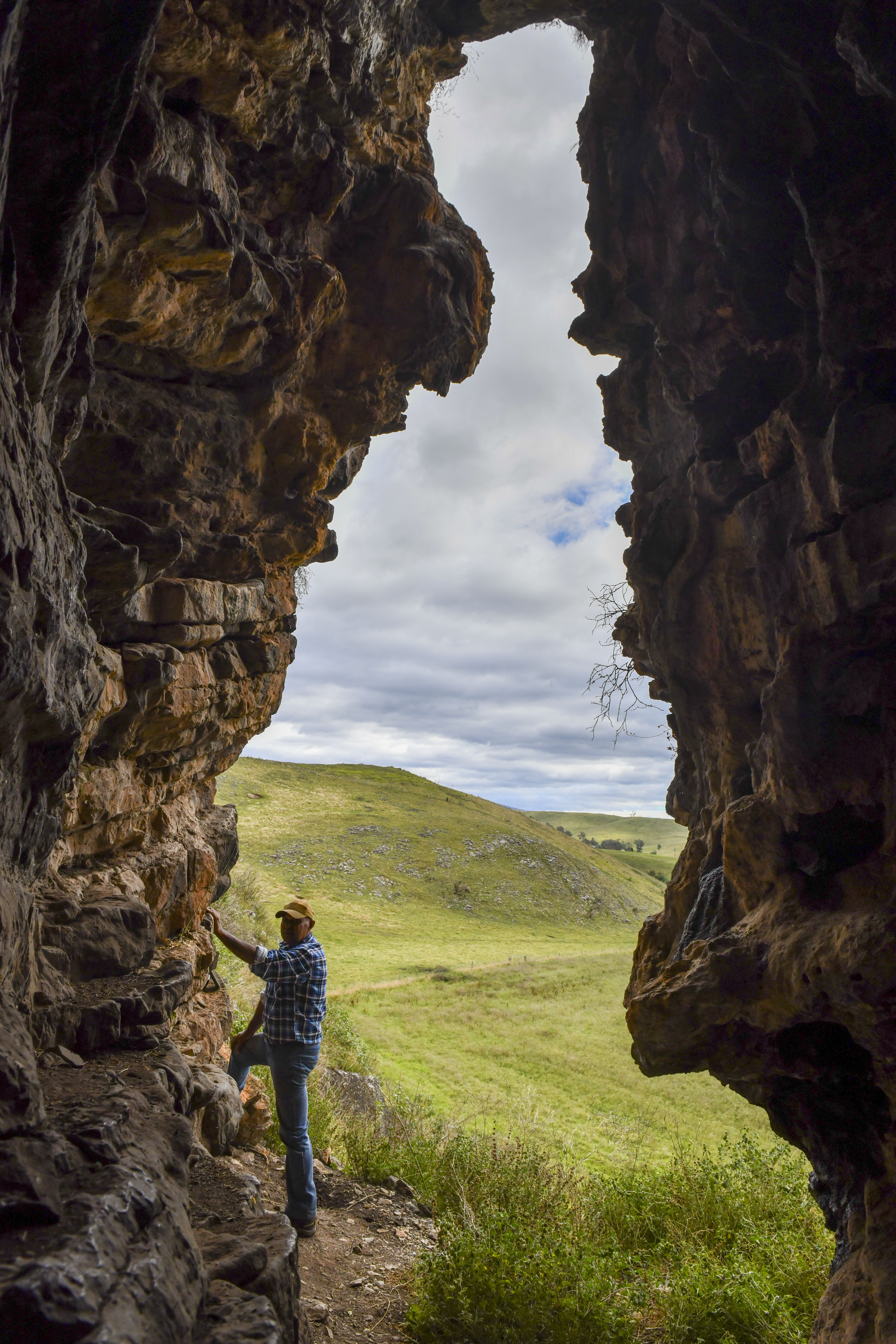 GunaiKurnai Elder Uncle Russell Mullett at the entrance to Cloggs Cave